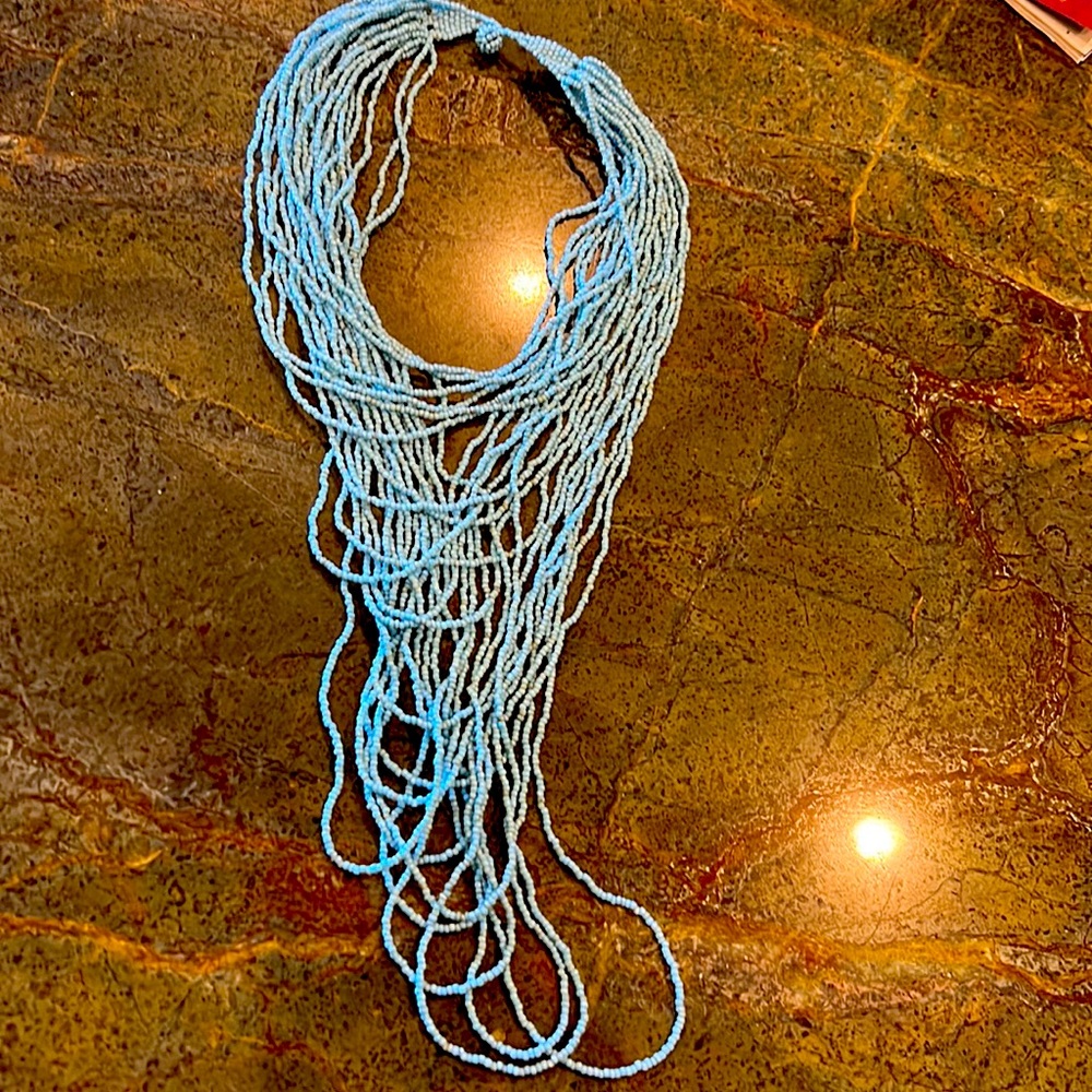 Turquoise blue-colored bead necklace from Bali.